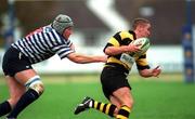 10 November 2001; Eoin Reddan of Young Munster is tackled by Richie Woods of Blackrock College during the AIB League match between Blackrock College and Young Munster at Stradbrook Road in Dublin. Photo by Matt Browne/Sportsfile