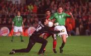 10 November 2001; Niall Quinn of Republic of Ireland in action against goal Iraninan goalkeeper Ebrahim Mirzapour and his team-mate Rahaman Rezaei during the 2002 FIFA World Cup Qualification Play-Off Final First Leg match between Republic of Ireland and Iran at Lansdowne Road in Dublin. Photo by Brendan Moran/Sportsfile