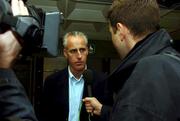 12 November 2001; Republic of Ireland manager Mick McCarthy is interviewed by media at Dublin Airport in Dublin, before the Republic of Ireland team's departure to Tehran, for the 2nd Leg of the World Cup Qualifying Play off against Iran. Photo by David Maher/Sportsfile