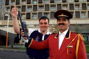 13 November 2001; Seamus Banim of eircom, with the help of Hotel Commissioner Mr Nagmaldin Rahmani, tests the satellite phone which will be used to assist the Media with communications for the match between Iran and the Republic of Ireland from Tehran. Photo by Ray McManus/Sportsfile