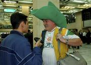 12 November 2001; Republic of Ireland supporter John Carney, from Castleknock in Dublin, is interviewed by Iranian Journalist Ali Benhnood of the Tamashag Ran Newspaper on arrival in Tehran Airport, Iran, ahead of the 2nd Leg of the World Cup Qualifying Play off against Iran. Photo by Ray McManus/Sportsfile
