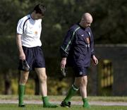 13 November 2001; Gary Breen, left, and Lee Carsley, walk to the bus with their ankles in icepacks after a Republic of Ireland Squad Training Session at the Azadi Sports Complex in Tehran, Iran. Photo by Brendan Moran/Sportsfile