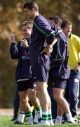 14 November 2001; Niall Quinn who did not take part during the squad training session, hold's his back as Matt Holland, back left, jokes with his team-mates during a Republic of Ireland Squad Training Session at Azadi Sports Complex in Tehran, Iran. Photo by David Maher/Sportsfile