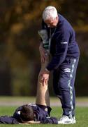 14 November 2001; Niall Quinn who did not take part during the squad training session, receives attention from team physio Mick Byrne during a Republic of Ireland Squad Training Session at Azadi Sports Complex in Tehran, Iran. Photo by David Maher/Sportsfile