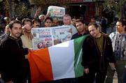14 November 2001; Republic of Ireland fan Sean Callan from Ardee in Louth, centre right, with Iranian supporters holding up a headline which says &quot;Ireland Wall Not So High&quot; in downtown in Tehran ahead of the Iran v Republic of Ireland - 2002 FIFA World Cup Qualification Play-Off Final Second Leg. Photo by Ray McManus/Sportsfile
