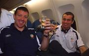 16 November 2001; Republic of Ireland goalkeepers, Alan Kelly and Shay Given celebrate with a glass of champagne on board their return flight to Dublin from Tehran, Iran, after the Republic of Ireland soccer team qualified for the 2002 World Cup Finals in Japan. Photo by David Maher/Sportsfile