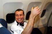 16 November 2001; Republic of Ireland goalkeeper, Shay Given celebrates with a glass of champagne on board his return flight to Dublin from Tehran, Iran, after the Republic of Ireland soccer team qualified for the 2002 World Cup Finals in Japan. Photo by David Maher/Sportsfile