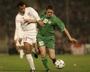 15 November 2001; Robbie Keane of Republic of Ireland in action against Yahya Golmohammadi of Iran during the 2002 FIFA World Cup Qualification Play-Off Final Second Leg match between Iran and the Republic of Ireland at Azadi Stadium in Tehran, Iran. Photo by Brendan Moran/Sportsfile