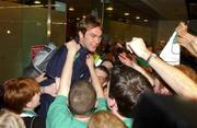 16 November 2001; Irish fans welcome home Jason McAteer after the Republic of Ireland soccer team qualified for the 2002 World Cup Finals in Japan during the homecoming at Dublin Airport in Dublin. Photo by David Maher/Sportsfile