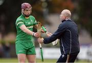 22 October 2016; Ryan McCambridge of Ireland gets a replacement hurley from kitman Tommy Byrne during the 2016 U21 Hurling/Shinty International Series match between Ireland and Scotland at Bught Park in Inverness, Scotland. Photo by Piaras Ó Mídheach/Sportsfile