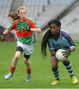 26 October 2016; Wanu Adanri of St. Mary's NS, Garristown, in action against Caoimhe French of Gaelscoil Mológa, Harold's Cross, in the Corn an Chladaigh final during the Allianz Cumann na mBunscol Finals at Croke Park in Dublin. Photo by Piaras Ó Mídheach/Sportsfile