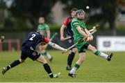 22 October 2016; Daniel Staunton of Ireland in action against Mikey MacKenzie of Scotland during the 2016 U21 Hurling/Shinty International Series match between Ireland and Scotland at Bught Park in Inverness, Scotland. Photo by Piaras Ó Mídheach/Sportsfile