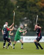 22 October 2016; Seán Whelan of Ireland in action against Oliver Macrae, left, and Craig Morrison of Scotland during the 2016 U21 Hurling/Shinty International Series match between Ireland and Scotland at Bught Park in Inverness, Scotland. Photo by Piaras Ó Mídheach/Sportsfile