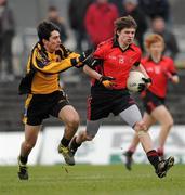 12 March 2011; Conal McKeever, Dundalk Colleges, is tackled by Evan Murtagh, St Pat's Navan. Leinster Colleges Senior Football 'A' Championship Final, St Pat's Navan v Dundalk Colleges, Paric Tailteann, Navan, Co. Meath. Picture credit: Ray McManus / SPORTSFILE