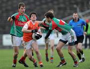 13 March 2011; Micheal O'Rourke, Armagh, in action against Jason Gibbons, left, and Tom Parsons, Mayo. Allianz Football League, Division 1, Round 4, Mayo v Armagh, McHale Park, Castlebar, Co. Mayo. Picture credit: Brian Lawless / SPORTSFILE