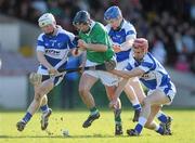 13 March 2011; Pat Tobin, Limerick, in action against Brian Stapleton, left, James Walsh and John A Delaney, right, Laois. Allianz Hurling League, Division 2, Round 4, Limerick v Laois, Gaelic Grounds, Limerick. Picture credit: Diarmuid Greene / SPORTSFILE