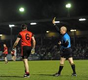 12 March 2011; Referee Derek Fahy, Longford, issues a yellow card to Kevin McKernan, Down. Allianz Football League, Division 1, Round 4, Cork v Down, Pairc Ui Rinn, Cork. Picture credit: Stephen McCarthy / SPORTSFILE