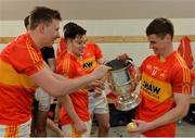 29 October 2016; Castlebar Mitchels players, from left, Eoghan O'Reilly, Cian Costello and Neil Douglas inspect the MocClair Cup after the Mayo Senior Club Football Championship Final match between Castlebar Mitchels and Knockmore at Elverys MacHale Park in Castlebar, Co. Mayo. Photo by Piaras Ó Mídheach/Sportsfile