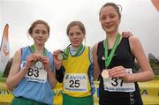 12 March 2011; Siofra Cleirigh Buttner, Colaiste Iosagain, Co. Dublin, who won the Intermediate Girls race with 2nd place Linda Conroy, left, Mercy, Kilbeggan, Co. Westmeath, and 3rd place Jean Clancy, right, St. Micheal's, Kilmihil, Co. Clare, at the AVIVA All-Ireland Schools Cross Country Championships 2011. National Sports Campus, Abbotstown, Dublin. Photo by Sportsfile