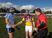13 March 2011; The Dublin captain Stephen Hiney, left, greets the Wexford captain Darren Stamp and referee Michael Wadding before the game. Allianz Hurling League, Division 1, Round 4, Wexford v Dublin, Wexford Park, Wexford. Picture credit: Ray McManus / SPORTSFILE
