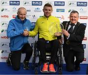 30 October 2016; Patrick Monahan from Co. Kildare with his trophy after winning the Wheelchair race along with race director Jim Aughney, left, and Lord Mayor Brendan Carr following the SSE Airtricity Dublin Marathon 2016 at Merrion Square in Dublin City. 19,500 runners took to the Fitzwilliam Square start line to participate in the 37th running of the SSE Airtricity Dublin Marathon, making it the fourth largest marathon in Europe. Photo by Stephen McCarthy/Sportsfile