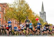 30 October 2016; Runners pass St Patricks Cathedral during the SSE Airtricity Dublin Marathon 2016 in Dublin. 19,500 runners took to the Fitzwilliam Square start line to participate in the 37th running of the SSE Airtricity Dublin Marathon, making it the fourth largest marathon in Europe. Photo by Ramsey Cardy/Sportsfile