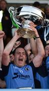 30 October 2016; Joe Lyons of Simonstown Gaels lifts the trophy following his team's victory in the Meath County Senior Club Football Championship Final game between Donaghmore/Ashbourne and Simonstown at Pairc Táilteann in Navan, Co. Meath. Photo by Seb Daly/Sportsfile