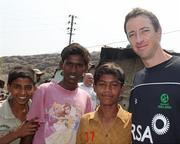 16 March 2011; Ireland cricket player Alex Cusack with local children on a team visit to a GOAL project in Kolkata, India. 2011 ICC Cricket World Cup, hosted by India, Sri Lanka and Bangladesh, Kolkata, India. Picture credit: Barry Chambers / Cricket Ireland / SPORTSFILE