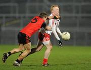 16 March 2011; Dermot McNulty, Tyrone, in action against Aaron Brannigan, Down. Cadbury Ulster GAA Football Under 21 Championship Quarter-Final, Down v Tyrone, Pairc Esler, Newry, Co. Down. Picture credit: Oliver McVeigh / SPORTSFILE