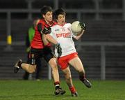 16 March 2011; Roonan O'Neill, Tyrone, in action against Conor Poland, Down. Cadbury Ulster GAA Football Under 21 Championship Quarter-Final, Down v Tyrone, Pairc Esler, Newry, Co. Down. Picture credit: Oliver McVeigh / SPORTSFILE