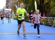 30 October 2016; Steve Casey with his daughter Saoirse, from Limerick City, finish the SSE Airtricity Dublin Marathon 2016 in Dublin City. 19,500 runners took to the Fitzwilliam Square start line to participate in the 37th running of the SSE Airtricity Dublin Marathon, making it the fourth largest marathon in Europe. Photo by Cody Glenn/Sportsfile
