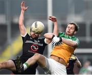 30 October 2016; Leon Kelly of Glenswilly in action against Donal Kane of Kilcoo during the AIB Ulster GAA Football Senior Club Championship quarter-final game between Kilcoo and Glenswilly at Pairc Esler, Newry, Co. Down. Photo by Oliver McVeigh/Sportsfile