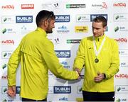 30 October 2016; Winner of the Irish Men's National Marathon Championship Sergie Ciobanu of Clonliffe Harriers AC, Dublin, left, is congratulated by second place Sean Hehir of Rathfarnham WSAF A.C, Dublin, following the SSE Airtricity Dublin Marathon 2016 in Dublin City. 19,500 runners took to the Fitzwilliam Square start line to participate in the 37th running of the SSE Airtricity Dublin Marathon, making it the fourth largest marathon in Europe. Photo by Stephen McCarthy/Sportsfile