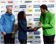 30 October 2016; Viola Jelagat Kibiwot of Kenya who finshed third with Ronan Brady, Head of Marketing, SSE Airtricity, right, and race director Jim Aughney following the SSE Airtricity Dublin Marathon 2016 in Dublin City. 19,500 runners took to the Fitzwilliam Square start line to participate in the 37th running of the SSE Airtricity Dublin Marathon, making it the fourth largest marathon in Europe. Photo by Stephen McCarthy/Sportsfile