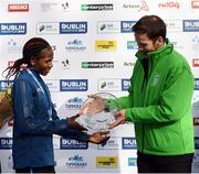 30 October 2016; Winner of the women's race Helalia Johannes of Namibia with Ronan Brady, Head of Marketing, SSE Airtricity, following the SSE Airtricity Dublin Marathon 2016 in Dublin City. 19,500 runners took to the Fitzwilliam Square start line to participate in the 37th running of the SSE Airtricity Dublin Marathon, making it the fourth largest marathon in Europe. Photo by Stephen McCarthy/Sportsfile