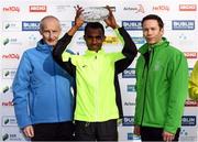 30 October 2016; Dereje Urgecha Beyecha of Ethiopa who finished second with race director Jim Aughney, left, and Ronan Brady, Head of Marketing, SSE Airtricity, following the SSE Airtricity Dublin Marathon 2016 in Dublin City. 19,500 runners took to the Fitzwilliam Square start line to participate in the 37th running of the SSE Airtricity Dublin Marathon, making it the fourth largest marathon in Europe. Photo by Stephen McCarthy/Sportsfile