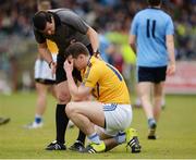 9 October 2016; Peter Donnelly of Coalisland Fianna being assisted by Referee Sean Hurson for possible concussion during the Tyrone County Senior Club Football Championship Final match between Killyclogher St Mary's and Coalisland Fianna at Healy Park in Omagh, Co. Tyrone. Photo by Oliver McVeigh/Sportsfile