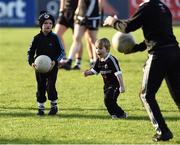 30 October 2016; Kilcoo supporters six year old Donal Og Kane and four year old Rico McCusker out helping their team warm up  before the AIB Ulster GAA Football Senior Club Championship quarter-final game between Kilcoo and Glenswilly at Pairc Esler, Newry, Co. Down. Photo by Oliver McVeigh/Sportsfile