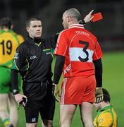 19 March 2011; Referee Padraig Hughes issues Kevin McCloy, Derry, with a red card in the second half. Allianz Football League Division 2 Round 5, Derry v Donegal, Celtic Park, Derry. Picture credit: Oliver McVeigh / SPORTSFILE