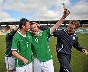 20 March 2011; Ireland's Eric O'Flaherty celebrates with team-mate Gary Messett, left, and Daragh Sheridan, Institute of Sport, right, after the match. CP Invitational Tournament, St. Patrick's Day Cup Final, Ireland v Holland, Tallaght Stadium, Tallaght, Dublin. Picture credit: Brian Lawless / SPORTSFILE