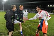 19 March 2011; The captains, Padraig Clancy, Laois, and Ryan McMenamin, Tyrone, and referee Michael Collins greet each other before the start of the game. Allianz Football League Division 2 Round 5, Laois v Tyrone, O'Moore Park, Portlaoise, Co. Laois. Picture credit: Ray McManus / SPORTSFILE