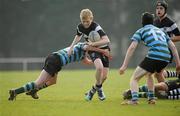 23 March 2011; Calum Quinn, Cistercian College Roscrea, is tackled by Tommy Whittle, left, and Paul McGann, St. Gerard's School. Fr. Godfrey Cup Final, Cistercian College Roscrea v St. Gerard's School, Templeville Road, Dublin. Picture credit: Barry Cregg / SPORTSFILE