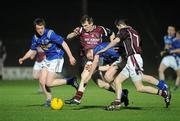 23 March 2011; Kieran Martin, centre, Westmeath, with support from team-mate James Dolan, gets a foot to the ball ahead of Padraig McCormack, left, and the falling James McGivney, Longford. Cadbury Leinster GAA Football Under 21 Championship Semi-Final, Longford v Westmeath, Pairc Tailteann, Navan, Co. Meath. Picture credit: Barry Cregg / SPORTSFILE