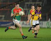 23 March 2011; Hughie Gahan, Carlow, in action against Emmet Kent, Wexford. Cadbury Leinster GAA Football Under 21 Championship Semi-Final, Carlow v Wexford, O'Moore Park, Portlaoise, Co. Laois. Picture credit: Matt Browne / SPORTSFILE