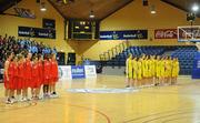 24 March 2011; The Colaiste Chiarain, Leixlip, Co. Kildare, and St. Louis Community School, Kiltimagh, Co. Mayo teams stand for the National Anthem before the game. Basketball Ireland Girls U16C Schools League Final, Colaiste Chiarain, Leixlip, Co. Kildare v St. Louis Community School, Kiltimagh, Co. Mayo, National Basketball Arena, Tallaght, Co. Dublin. Picture credit: Barry Cregg / SPORTSFILE