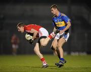 23 March 2011; Peter Daly, Cork, in action against Alan Maloney, Tipperary. Cadbury Munster GAA Football Under 21 Championship Semi-Final, Cork v Tipperary, Pairc Ui Rinn, Cork. Picture credit: Stephen McCarthy / SPORTSFILE