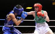 25 March 2011; Ryan Lindberg, Ireland, right, exchanges with Hongliang Zhang, China, during their 56kg bout. Boxing International, Ireland v China, National Stadium, Dublin. Picture credit: Brian Lawless / SPORTSFILE