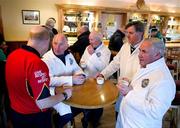 26 March 2011; Referee Richard Maloney, Limerick, and his umpires, Richard Maloney, senior, Michael Maloney, Tadhg O'Sullivan and John Hurley, enjoy a cup of tea, during half-time, in the Conahy Shamrocks GAA Club bar. Allianz Football League, Division 4, Round 7, Kilkenny v Fermanagh, Conahy Shamrocks GAA Club, Jenkinstown, Co. Kilkenny. Picture credit: Ray McManus / SPORTSFILE
