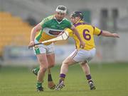 27 March 2011; Ger Healion, Offaly, in action against Darren Stamp, Wexford. Allianz Hurling League, Division 1, Round 5, Offaly v Wexford, O'Connor Park, Tullamore, Co. Offaly. Photo by Sportsfile