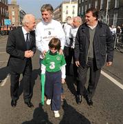27 March 2011; Republic of Ireland manager Giovanni Trapattoni, left, with FAI Chief Executive John Delaney, and his son Thomas, and Republic of Ireland assistant manager Marco Tardelli, right, at the start of the Dublin leg of the John Giles Foundation, 'Walk of Dreams', in association with Three, Ireland's fastest growing mobile network. The fundraising walk which took place in 14 locations nationwide brought nearly 50,000 people from all over Ireland to raise funds for the beautiful game and the John Giles Foundation, to continue the growth of football. The ‘Walk of Dreams’ took place in Letterkenny, Sligo, Castlebar, Galway City, Ennis, Limerick City, Tralee, Cork City, Athlone, Thurles, Waterford City, Enniscorthy, Dublin City and Dundalk. The John Giles Foundation was founded to use football as a vehicle for social change, to build community cohesion, increase participation and to improve health and education by providing funding to help football in clubs, schools and community groups in Ireland. Half of the funds raised will be retained by participating football clubs while the other half will go to the Foundation for community football projects in clubs, schools and community groups throughout Ireland. John Giles Foundation ‘Walk of Dreams’ in association with Three. Fitzwilliam Street via Ringsend to Aviva Stadium. Picture credit: Stephen McCarthy / SPORTSFILE